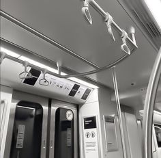 an empty train car with two doors and no people on the inside, in black and white