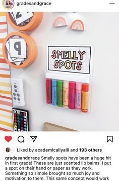 a white refrigerator with some crayons and markers on the magnets next to it