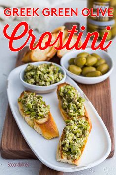 greek green olive crostini on a white plate