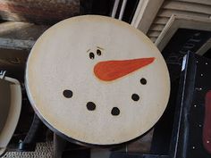 a close up of a snowman plate on a table