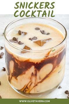 an ice cream dessert in a glass with chocolate chips on top and text overlay that reads, how to make snickkers cocktail