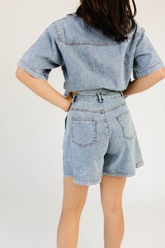 the solution to your summer // fall outfit woes, this button-up denim top + short set is an iconic essential. featuring an oversized short sleeve top + coordinating wide-leg denim shorts, it’s a set you can style together or separately for endless outfit possibilities. we love it paired with cowboy boots, chunky loafers, + everything in between denim blue // collared, breast pockets, buttons, high waisted, one button fly zip, belt loops, front + back pockets, wide leg model is 5'8" + wearing a s Chic Relaxed Fit Short Sleeve Denim Top, Chic Short Sleeve Relaxed Fit Denim Top, Spring Denim Button-up Shorts, Spring Button-up Denim Shorts, Summer Button-up Jean Shorts, Button-up Jean Shorts For Summer, Oversized Denim Top For Summer, Trendy Button-up Jean Shorts For Summer, Trendy Oversized Summer Denim Top