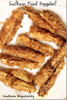 fried eggplant on a white plate with the words southern fried eggplant