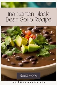 a bowl of black bean soup with avocado and cilantro