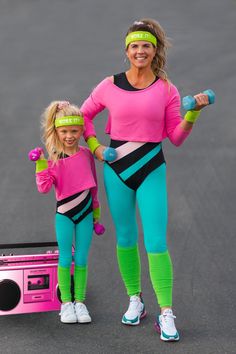 the woman and child are posing for a photo with their pink headbands on