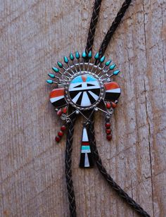 Offered is another intricate and dynamic Zuni bolo tie.   We've been researching this artist for some time and have yet to identify the maker.  Extraordinary design and silver-work as well as the finest materials always set this artist's work apart. We're excited to continue our research in hope's of giving credit to such an amazing early Zuni artist.  This example is just beautiful. We include a side by side image of another separately listed piece by this artist.  We think they're incredible. Handmade Silver Bolo Tie As A Gift, Handmade Silver Bolo Tie For Gift, Unique Silver Bolo Tie As A Gift, Unique Silver Bolo Tie For Gift, Unique Silver Bolo Ties As Gift, Unique Silver Bolo Ties For Gift, Handmade Sterling Silver Bolo Tie As Gift, Handmade Southwestern Bolo Ties, Southwestern Sterling Silver Bolo Tie As Gift