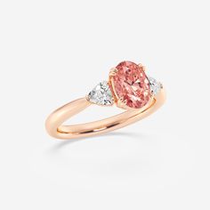 2 ctw Oval Lab Grown Diamond Fancy Pink With Trillion Three-Stone Engagement Ring 14K Rose Gold Luxury Oval Rose Gold Diamond Ring, Luxury 14k Rose Gold Oval Rings, 14k Rose Gold Ring With Oval Shape, Oval 14k Rose Gold Ring In Pink Gold, Oval Rose Gold Rings With Brilliant Cut, Rose Gold Oval Wedding Ring With Accent Stones, Oval Morganite Wedding Ring With Brilliant Cut, Oval Rose Gold Diamond Ring With Gemstone, Oval Brilliant Cut 14k Rose Gold Jewelry