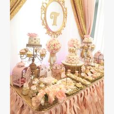 a table topped with lots of cakes and desserts