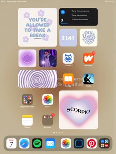 an ipad with several different app icons on the screen and in front of it, there is a heart