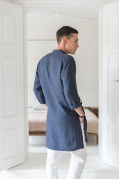 "A classic style redefined with modern styling, we created a linen tunic for men to fill that gap in your everyday wardrobe. The linen shirts are breathable and durable to provide maximum comfort, and they've kept it simple with roll-up sleeves and button-up closure. Step out in style no matter the occasion with a little help from our signature linen tunic. Handmade by masters of their craft in Lithuanian, where skills have been passed down for generations, your wardrobe's latest addition is sur Relaxed Fit Long Sleeve Linen Kurta, Spring Linen Tunic Kurta, Summer Linen Kurta With Relaxed Fit, Spring Linen Kurta With Relaxed Fit, Casual Linen Kurta With Relaxed Fit, Casual Linen Kurta For Summer, Summer Linen Kurta Tunic, Summer Linen Tunic Kurta, Casual Linen Kurta Tunic