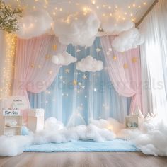 a baby's room decorated in pink, blue and white with stars and clouds