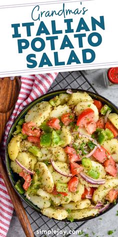 a pan filled with pasta and vegetables on top of a table