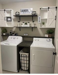 a washer and dryer in a laundry room with shelves on the wall above them