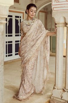 Brown saree with paisley print and scallop and ruffle edged detailing. Paired with coordinating blouse and floral, pearls, beads, stones, tassels and sequins embroidery. - Aza Fashions Baju Kahwin, Chikankari Saree, Saree Wearing Styles, Sarees For Girls, Simple Saree Designs, Sari Design, Fancy Sarees Party Wear, Traditional Indian Dress, Simple Sarees