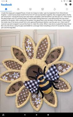 a door hanger with a bee on it