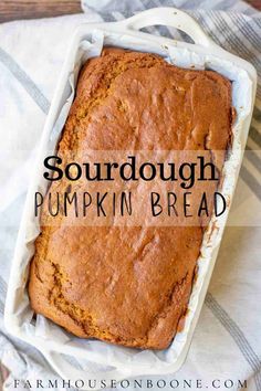 a loaf of pumpkin bread in a pan with the words sourdough pumpkin bread