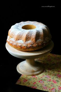 a bundt cake sitting on top of a pedestal