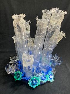 some very pretty vases made out of plastic bottles