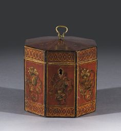 an ornately decorated wooden box with carvings on the front and sides, in red