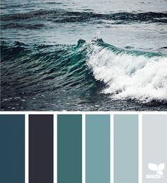 an ocean scene with waves and blue hues in shades of gray, teal, and white