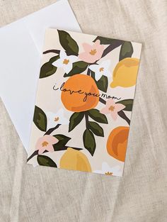 an orange card with the words i love you mom written on it