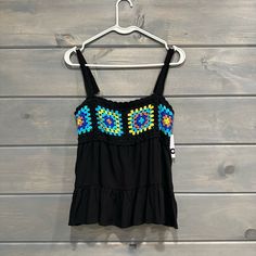 Flowy Black Tank Top With Adjustable Straps. Super Cute Crochet Detail Across Chest. Women’s Size Medium. New With Tags. Stretch Camisole Vest For Beach, Trendy Beach Camisole, Stretch Sleeveless Crochet Top For Beach Season, Sleeveless Stretch Crochet Top For Beach Season, Fitted Multicolor Camisole For Beach, Black Cotton Beach Vest, Black Vest For Beach In Summer, Stretch Vest For Vacation, Black Stretch Vest For The Beach