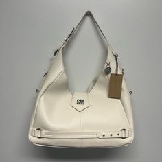 Beautiful New Large Hobo Purse With Magnetic Clasp Closure. Silver Hardware And Adjustable Strap. Suede Like Inside With Pockets And Compartments. Color Is Vanilla. White Leather Casual Hobo Bag, White Hobo Bag With Adjustable Strap, Trendy White Hobo Bag For Office, Chic White Hobo Bag For Office, Elegant White Hobo Bag For Office, Hobo Purse, Steve Madden Bags, Leather Hobo Bag, Leather Hobo