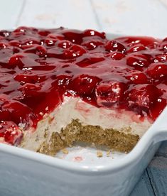 a close up of a cake in a pan with cherries on top and the words classic cherry delight