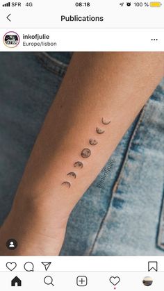 a person with a tattoo on their arm that has phases of the moon in them