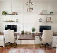 a home office with two computer desks and an orange area rug on the floor