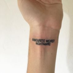 a person's arm with a tattoo that reads, fauquitte worst nightmares