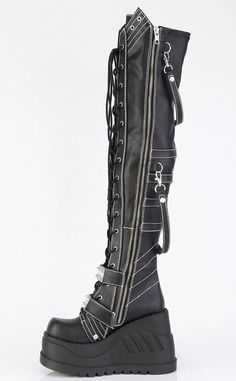 The stompiest boots around! These chonky wedges are a gift from the platform gods, slip in and stomp around babey!!! Vegan Black stretch PU leather 4 3/4 (121mm) inch platform Lace-up Featuring Two Hook-N-Loop Straps W/ Spike Studded Metal Plate White Contrast Stitching & Removable Hanging Strap Details, Full length inside zip closure U.S. women's sizing-refer to size chart for more info. Gothic High-top Platform Wedge Boots, Alternative Leather Platform Boots For Concert, Leather Wedge Heel Platform Boots For Streetwear, Gothic Faux Leather Boots For Alternative Fashion, Gothic Wedge Boots With Platform And Round Toe, Gothic Leather Wedge Boots With Chunky Platform, Black Gothic Leather Platform Boots, Punk Leather Platform Boots For Concert, Edgy Black Faux Leather Platform Boots