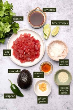 ingredients to make an avocado salad laid out on a white plate with green garnishes