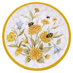 a plate with flowers and bees painted on it