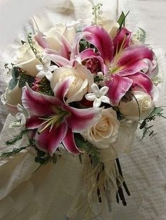 a bridal bouquet with pink and white flowers