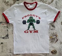 FROGGY'S GYM by Chillin' Froggy Old School Bodybuilding Vintage Logo Ringer T-shirt. Brand New without tag. Sizes Available: Medium, Large and Extra Large. 100% Cotton. Old School Bodybuilding, T Shirt Brand, Shirt Brand, Vintage Logo, Old School, Bodybuilding, Extra Large, Adult Outfits, Tops & Tees