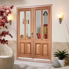 a living room with two doors and a potted plant