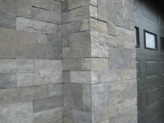 the side of a building made out of stone blocks