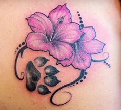 a woman's back with pink flowers on it