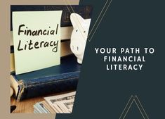 a piggy bank sitting on top of a pile of books next to a sign that says financial literacy