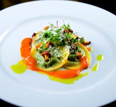 a white plate topped with food on top of a table