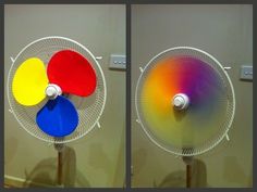 two different colored fans sitting on top of each other