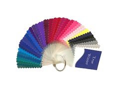 an assortment of color swatches with a keychain attached to the front and side