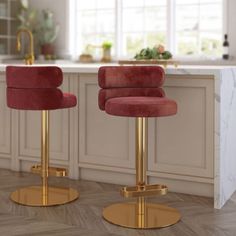 two red velvet bar stools in a kitchen