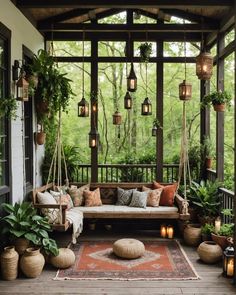 a porch covered in lots of plants and hanging lights