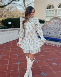 Saddle up in style with the Quinlynn Taupe Floral Ruffle Bow Dress. This versatile dress is perfect for any occasion, whether you're hitting the rodeo in your cowgirl boots or stepping out in the spring sun with wedges. With its playful ruffle and bow details, you'll be the talk of the town. Giddy up and grab yours today! Product Details: Features: Adjustable bow tie. Ruffle details. Side zipper closure. Fit: True to size. Model is 5'3 and wearing a size small. Fabric: 100% cotton; Lining- 100% Fall Ruffled Mini Dress For Garden Party, Spring Fitted Dress With Ruffle Hem, Fitted Spring Dress With Ruffle Hem, Spring Mini Dress With Ruffle Hem For Day Out, Talk Of The Town, Bow Dress, The Talk, Stepping Out, Versatile Dresses