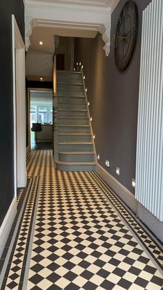 a black and white checkered floor with stairs