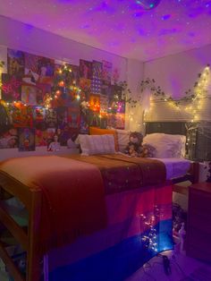 a bedroom decorated with lights and pictures on the wall