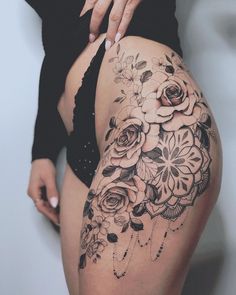 a woman's thigh with flowers on it