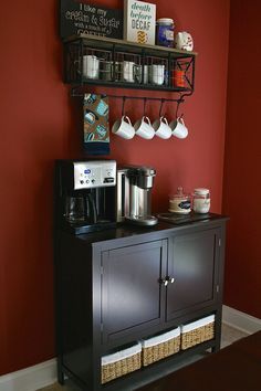 a coffee bar with two shelves above it and cups on the top shelf next to it